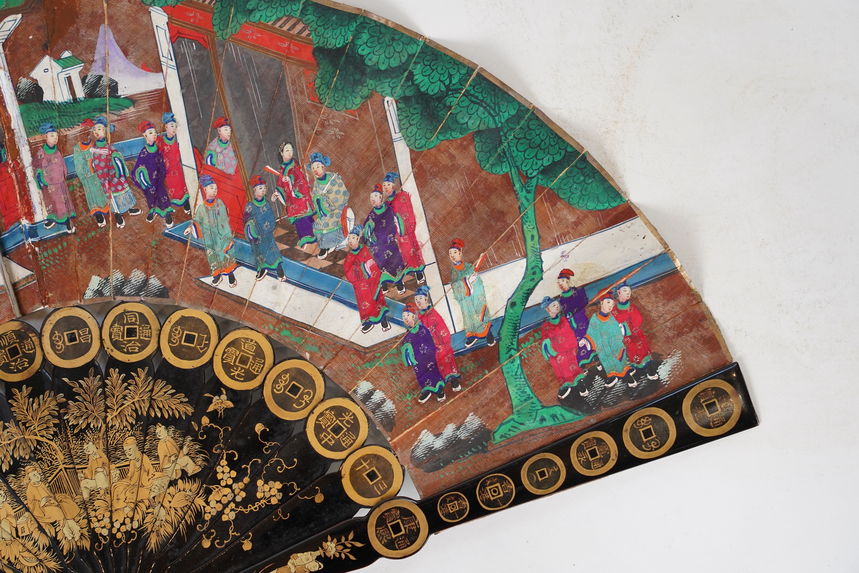 Three Chinese gilt-decorated black lacquer and painted leaf fans, 19th century